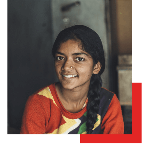 Girl smiling thanks to Project Rescue Midlevel & Major Donors